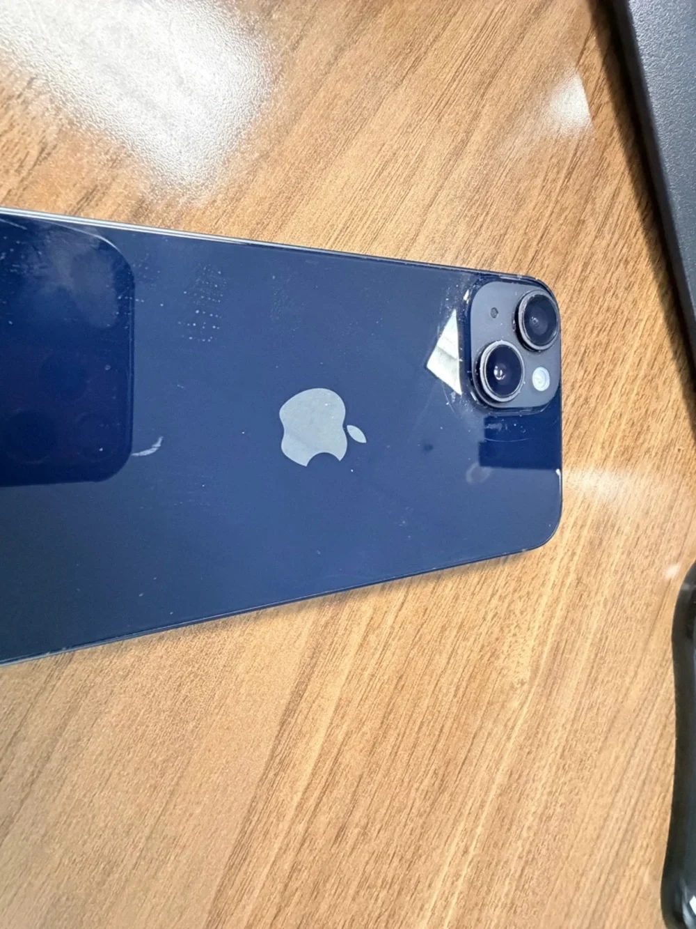 Apple iPhone with Black Frame and Colorful App Icons